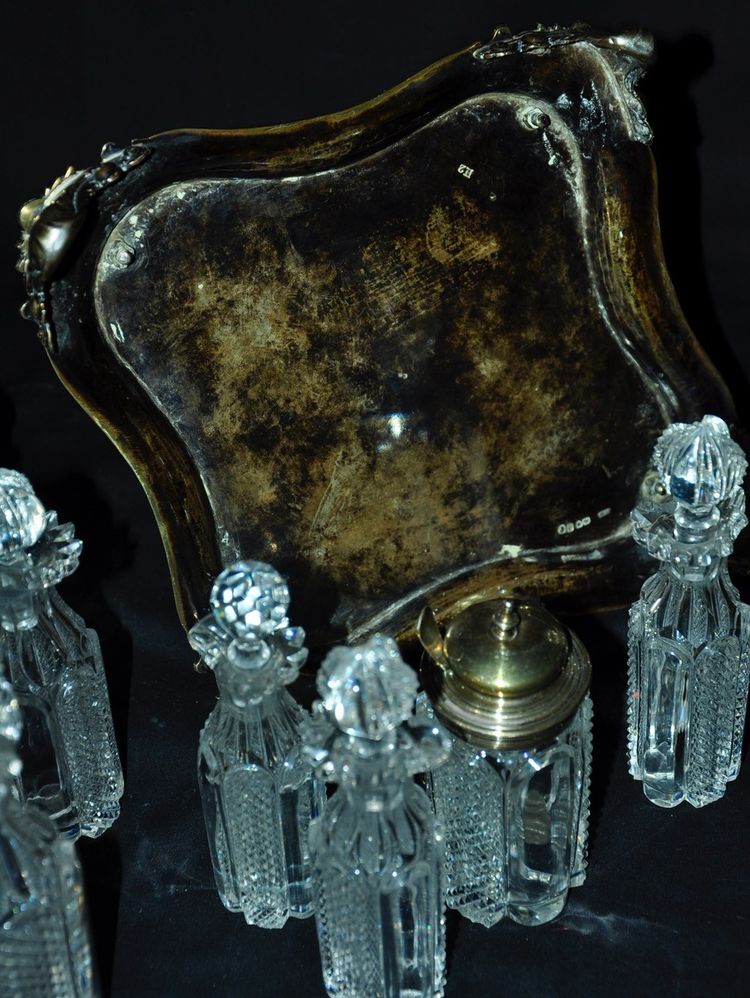 Crystal condiment set with silver frame