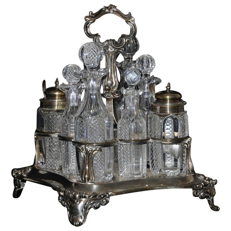 Crystal condiment set with silver frame