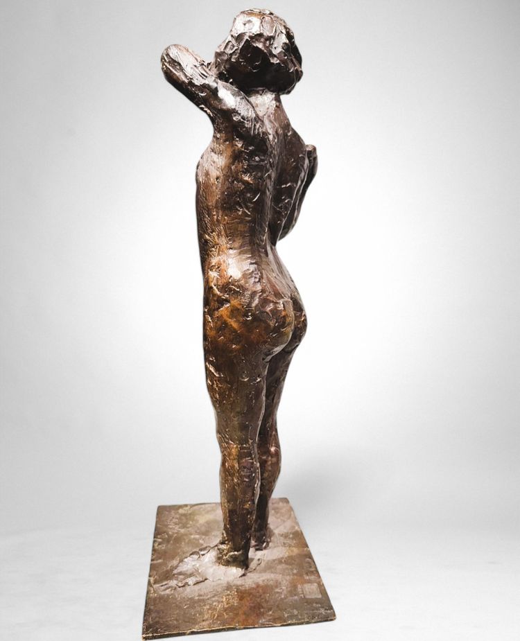 Dancer stapling the epaulette to her bodice - Edgar Degas, Valsuani cast, 1998