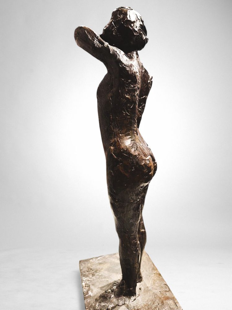 Dancer stapling the epaulette to her bodice - Edgar Degas, Valsuani cast, 1998