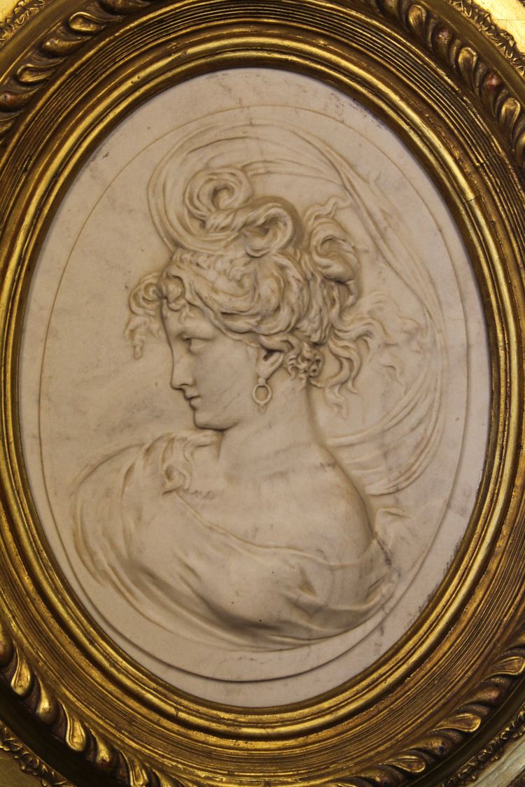 Pair of carved marble medallions with women's profiles in low relief by Louis Bottée expo 1889