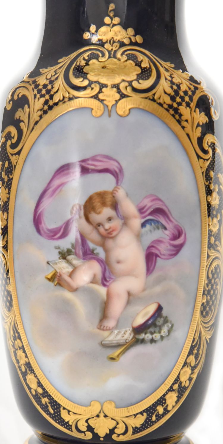 Pair of porcelain of Paris vases decorated with putti scenes
