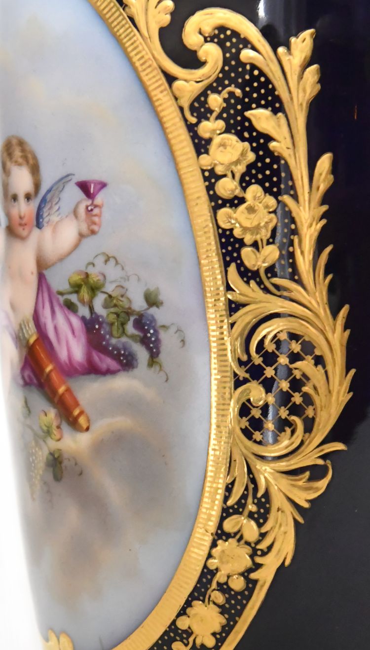 Pair of porcelain of Paris vases decorated with putti scenes