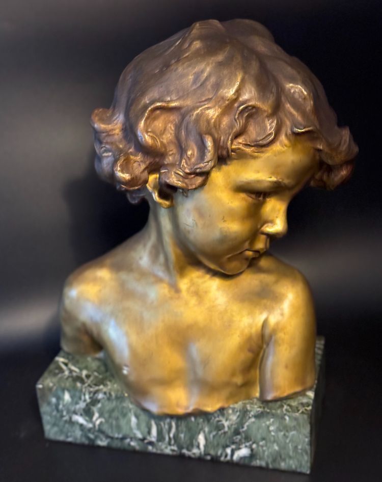 J.-M. CAMUS Large bust of a child in gilded and patinated bronze.