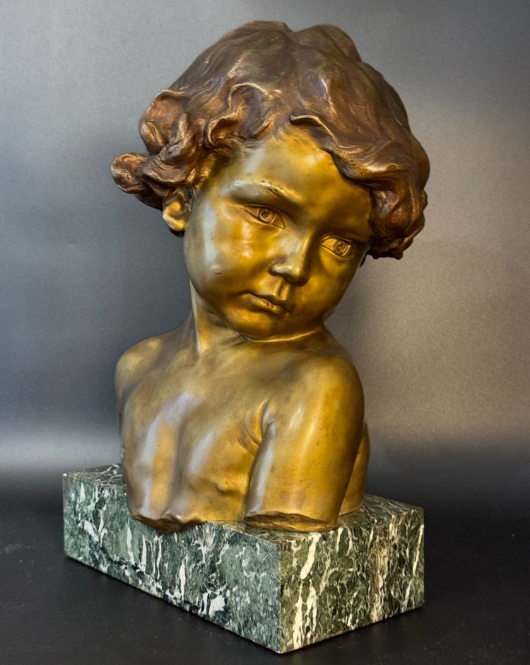 J.-M. CAMUS Large bust of a child in gilded and patinated bronze.