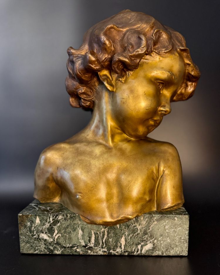 J.-M. CAMUS Large bust of a child in gilded and patinated bronze.