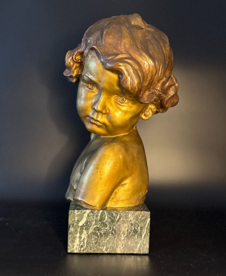 J.-M. CAMUS Large bust of a child in gilded and patinated bronze.