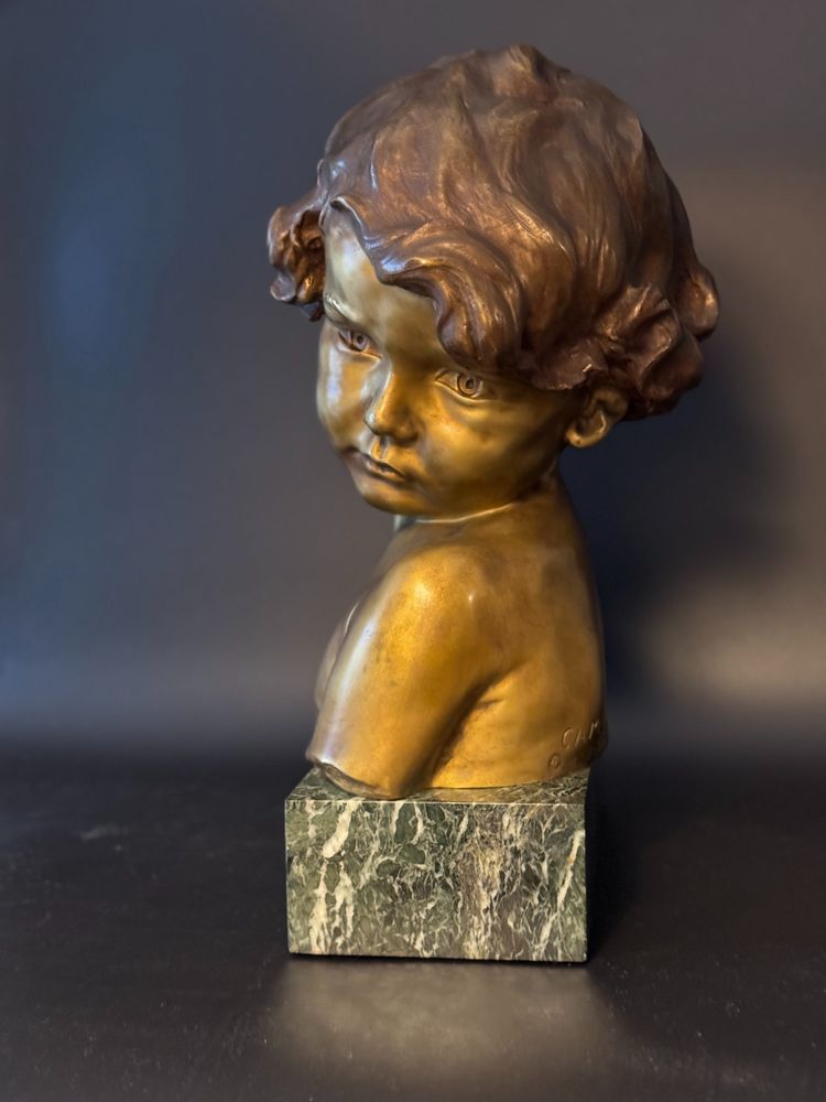 J.-M. CAMUS Large bust of a child in gilded and patinated bronze.