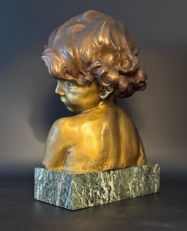 J.-M. CAMUS Large bust of a child in gilded and patinated bronze.