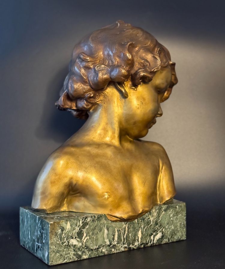 J.-M. CAMUS Large bust of a child in gilded and patinated bronze.