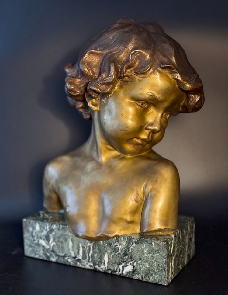 J.-M. CAMUS Large bust of a child in gilded and patinated bronze.