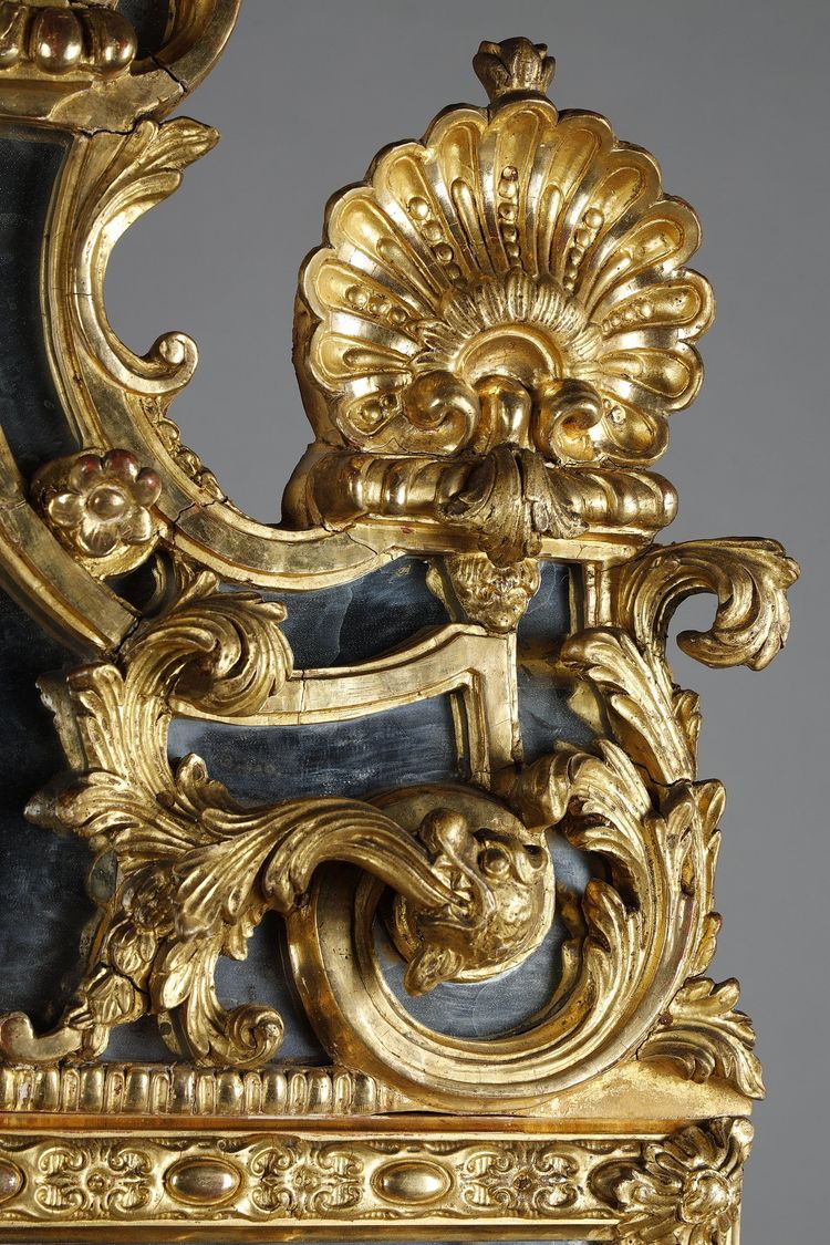 LARGE MIRROR WITH GLAZING BEADS DECORATED WITH SHELLS, FOLIAGE AND MASKS