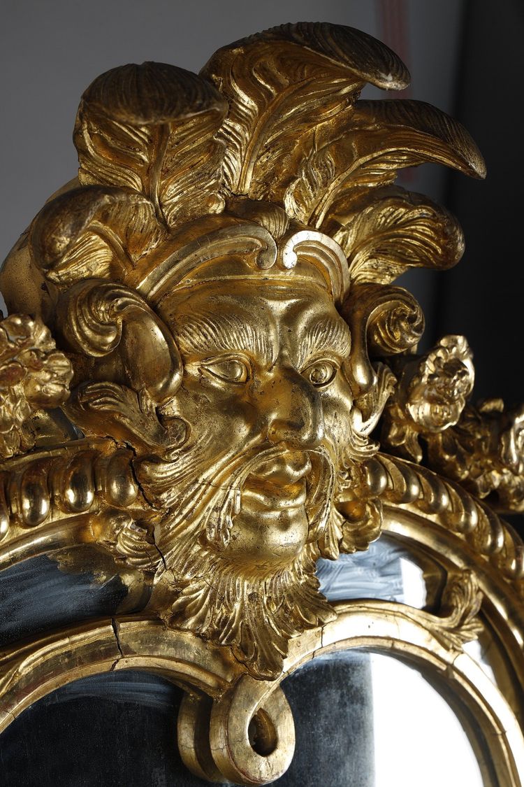 LARGE MIRROR WITH GLAZING BEADS DECORATED WITH SHELLS, FOLIAGE AND MASKS