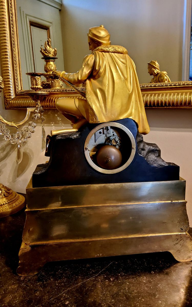 Clock with the "Painter Raphael" in gilded and patinated bronzes Restoration period 19th century