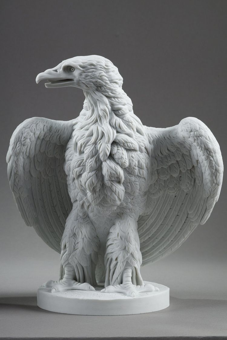 PAIR BISCUIT SCULPTURES OF NAPOLEON III EAGLES