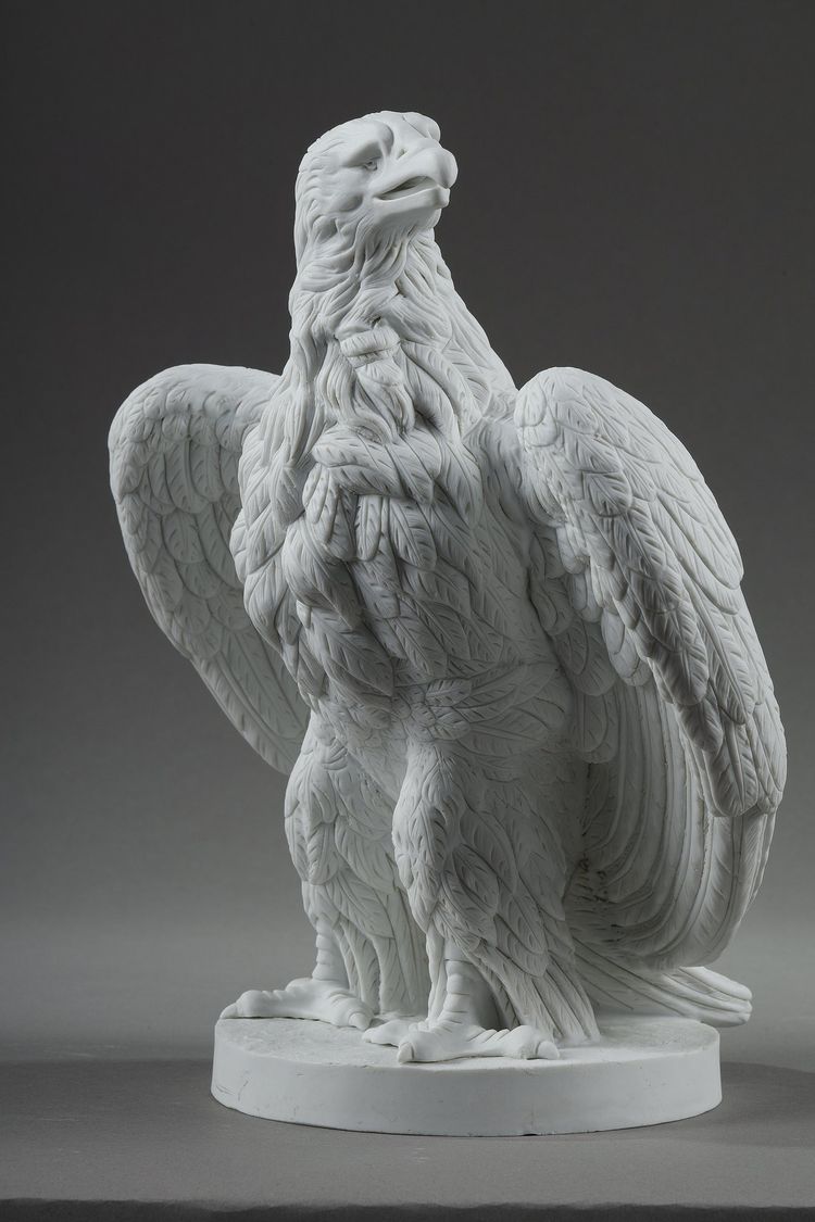 PAIR BISCUIT SCULPTURES OF NAPOLEON III EAGLES