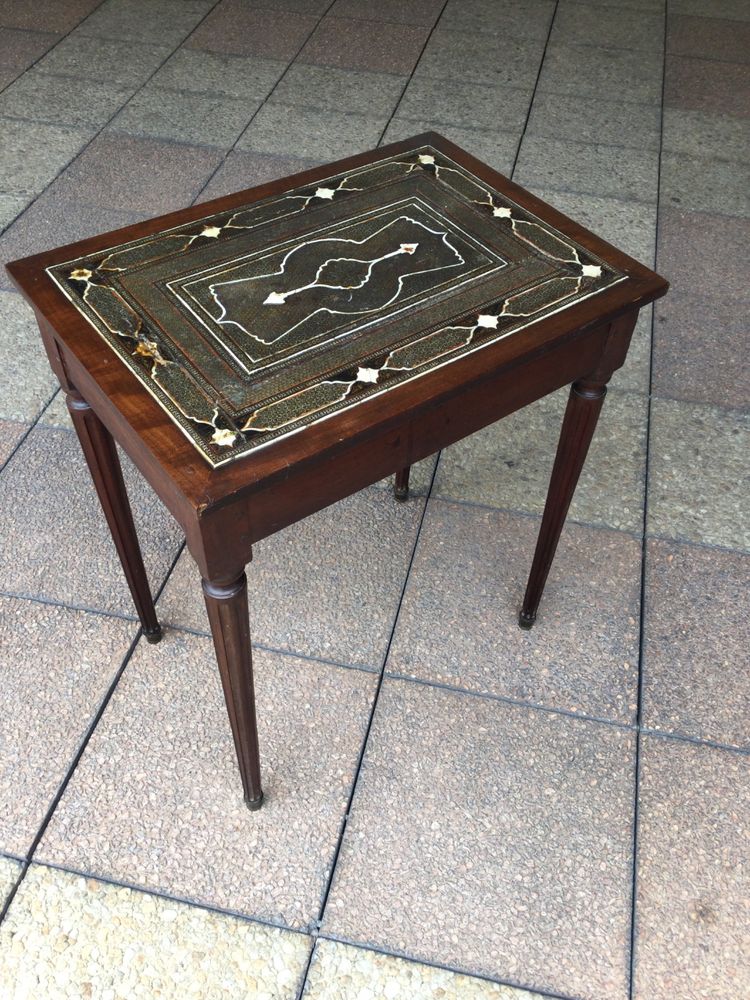 A small Louis XVI mahogany side table with an oriental-style top