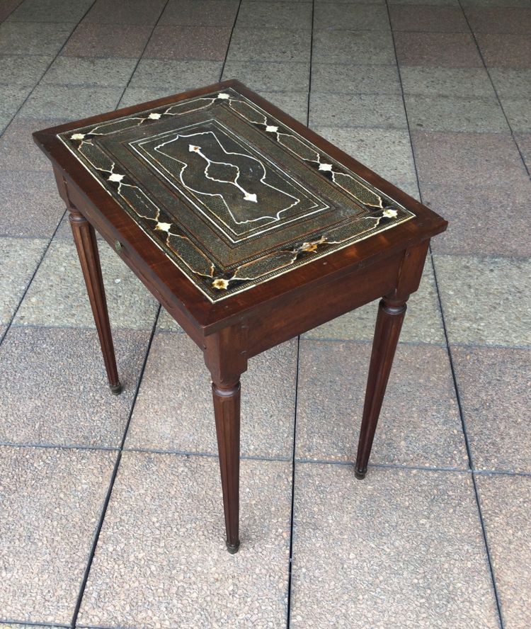 A small Louis XVI mahogany side table with an oriental-style top