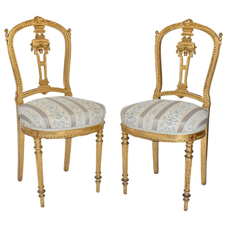 Pair of Louis XVI style chairs in gilded wood