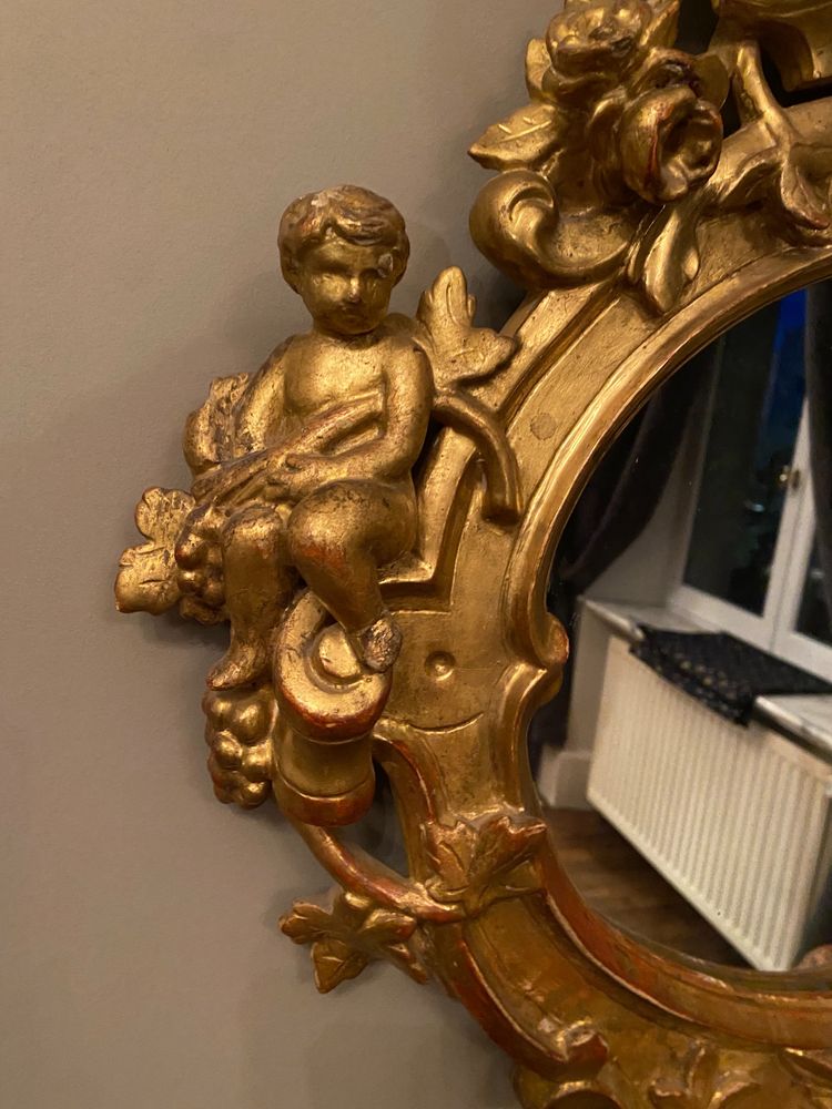 Gilded mirror, oval, 18th century