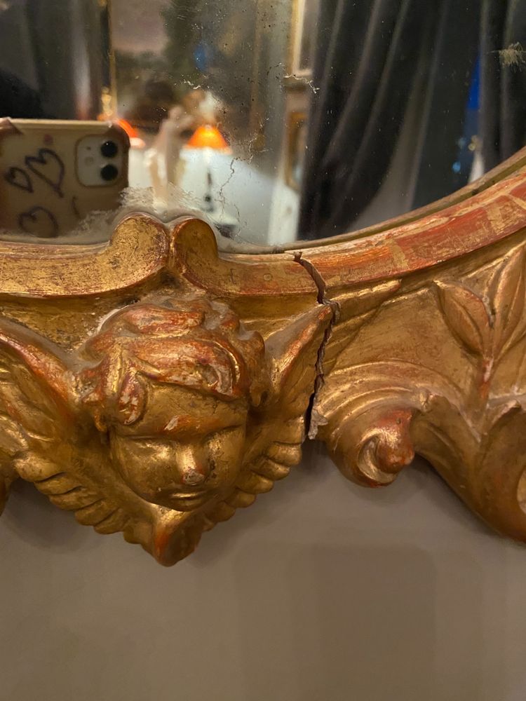 Gilded mirror, oval, 18th century