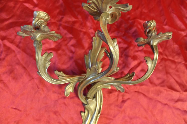 Pair of bronze sconces with 3 light arms in the Louis XV style, 19th century h: 45 cm