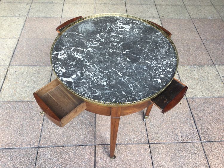 A pedestal table called a "bouillotte table"
