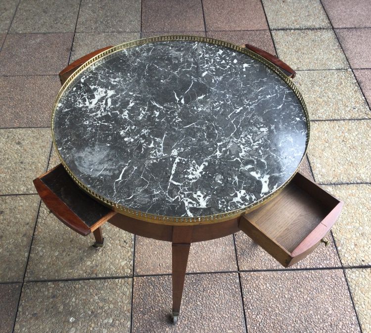 A pedestal table called a "bouillotte table"