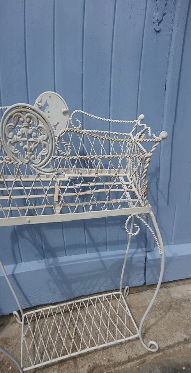 Planter on wrought-iron legs