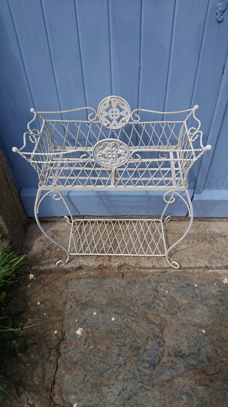 Planter on wrought-iron legs