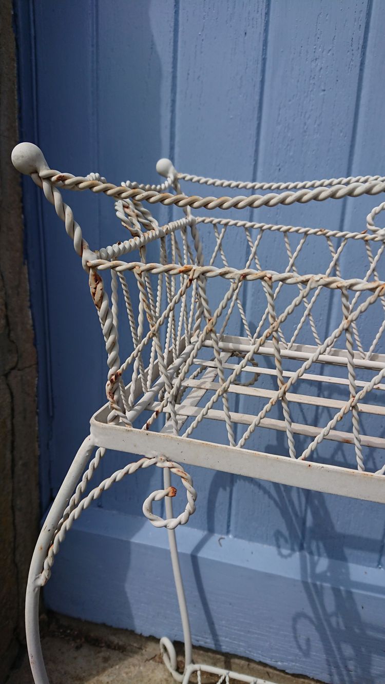 Planter on wrought-iron legs