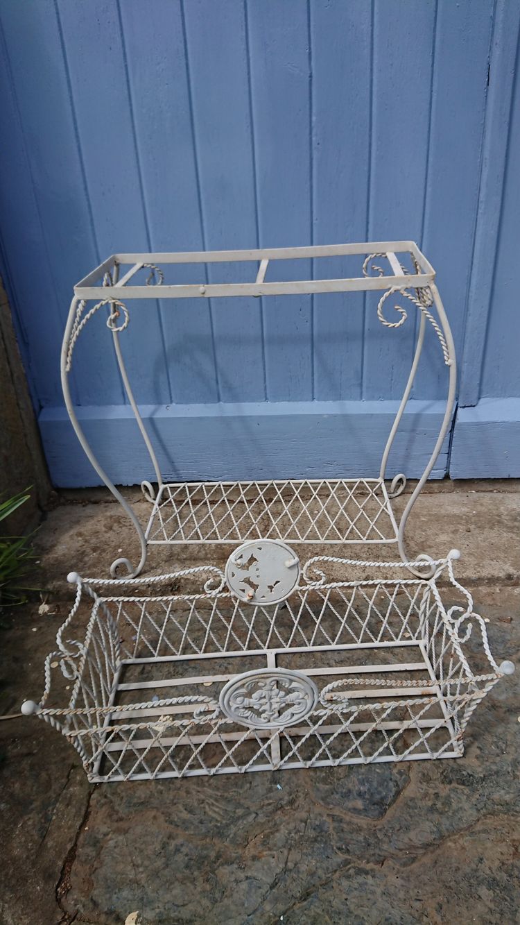 Planter on wrought-iron legs
