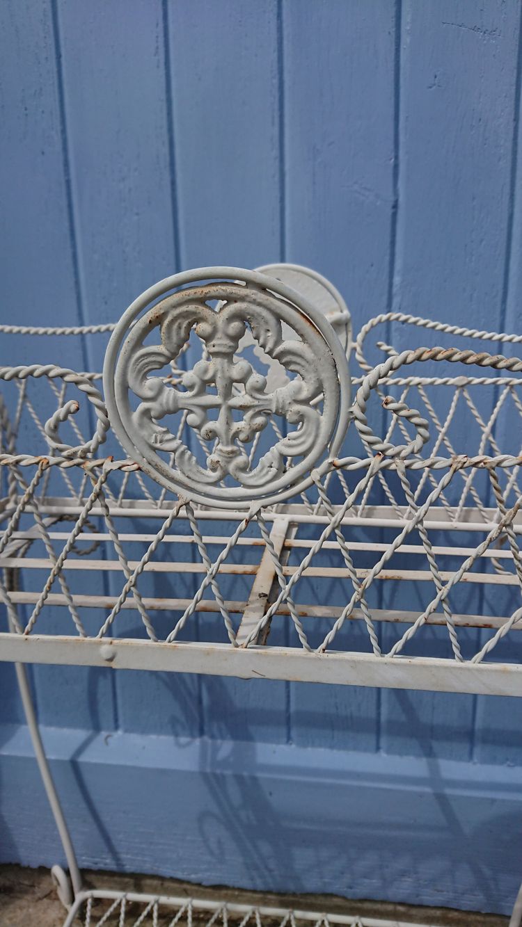 Planter on wrought-iron legs