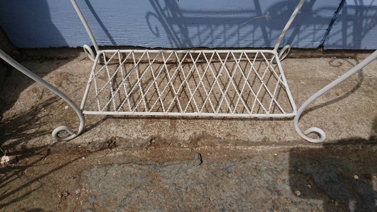 Planter on wrought-iron legs