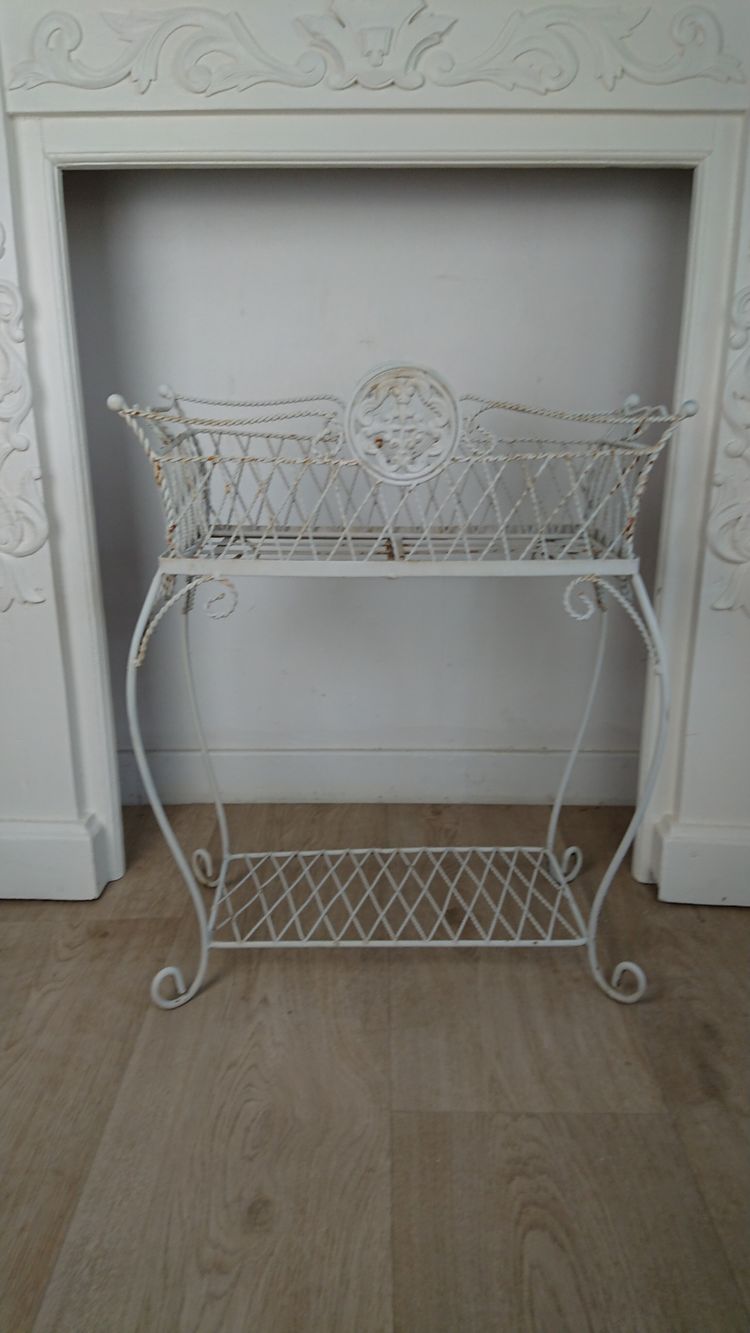 Planter on wrought-iron legs