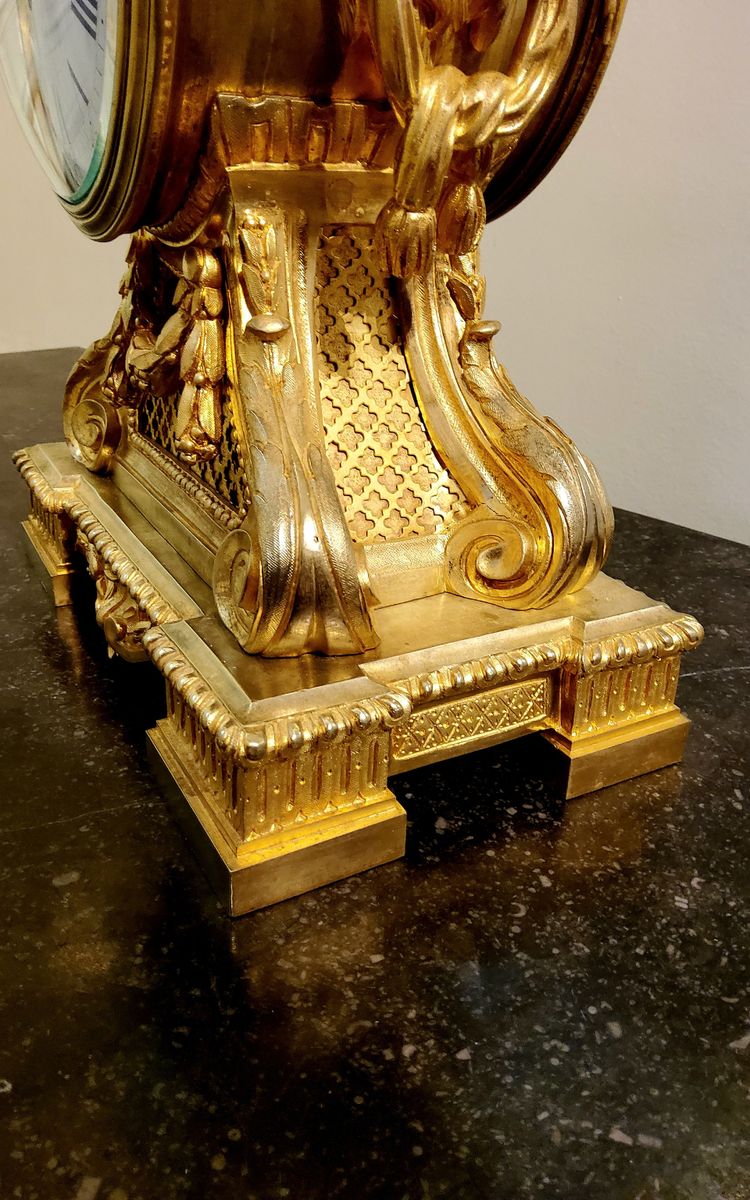 Louis XVI style clock in gilded bronzes with Lions' heads Greek decor 19th century