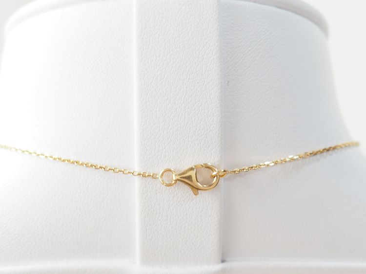 Collier pendentif marguerite en or jaune et grenats