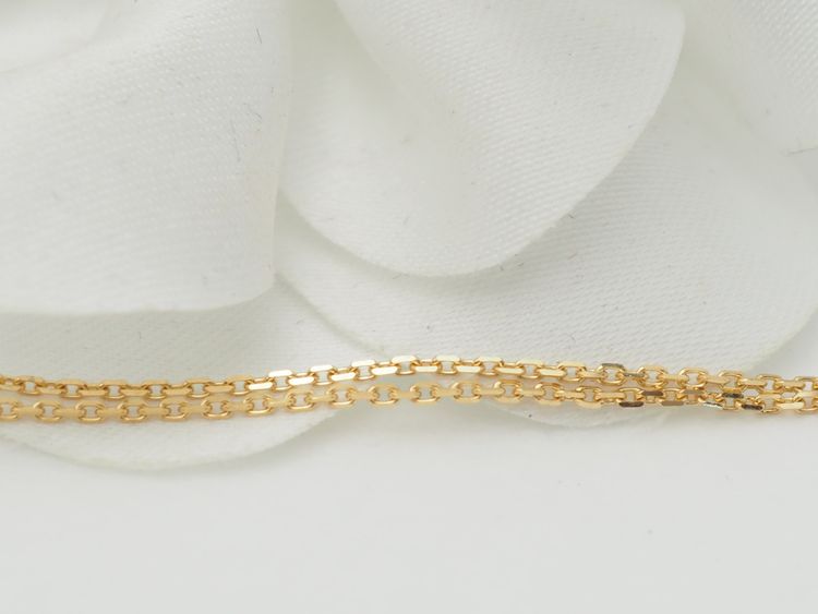 Collier pendentif croix en or jaune et grenats 