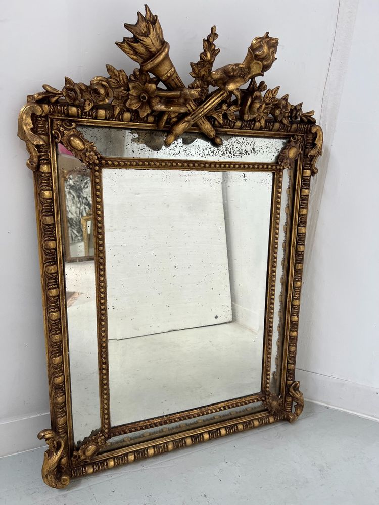 Miroir a pare closes de style Louis XVI en bois et stuc doré XIX siècle
