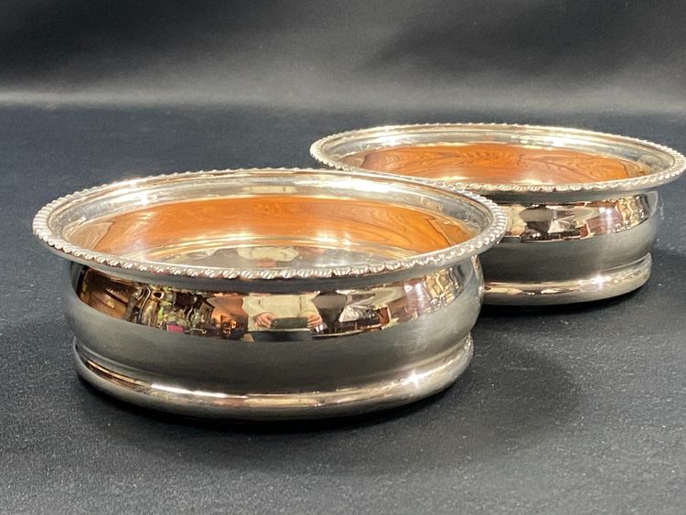 Pair of Louis XV style silver-plated metal coasters