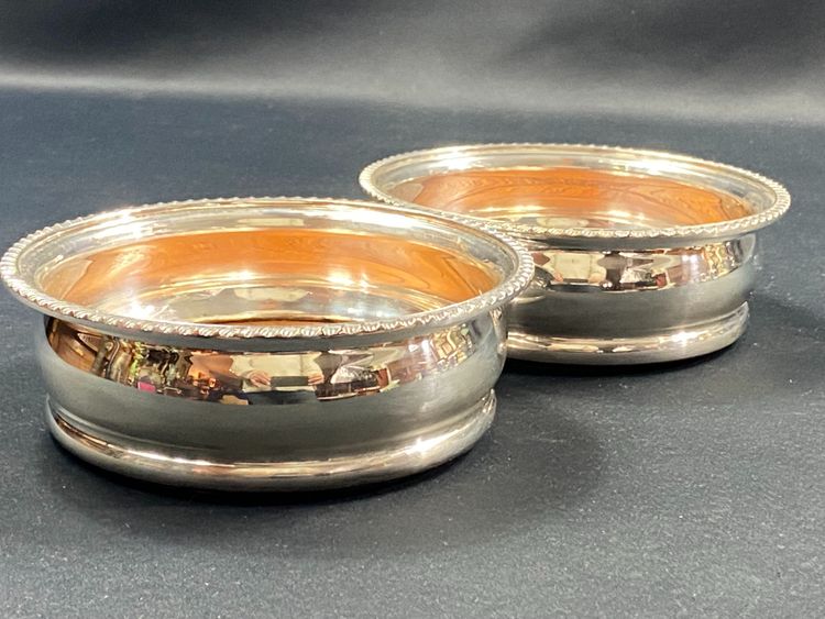 Pair of Louis XV style silver-plated metal coasters