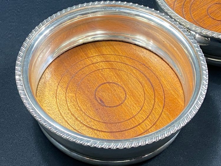Pair of Louis XV style silver-plated metal coasters
