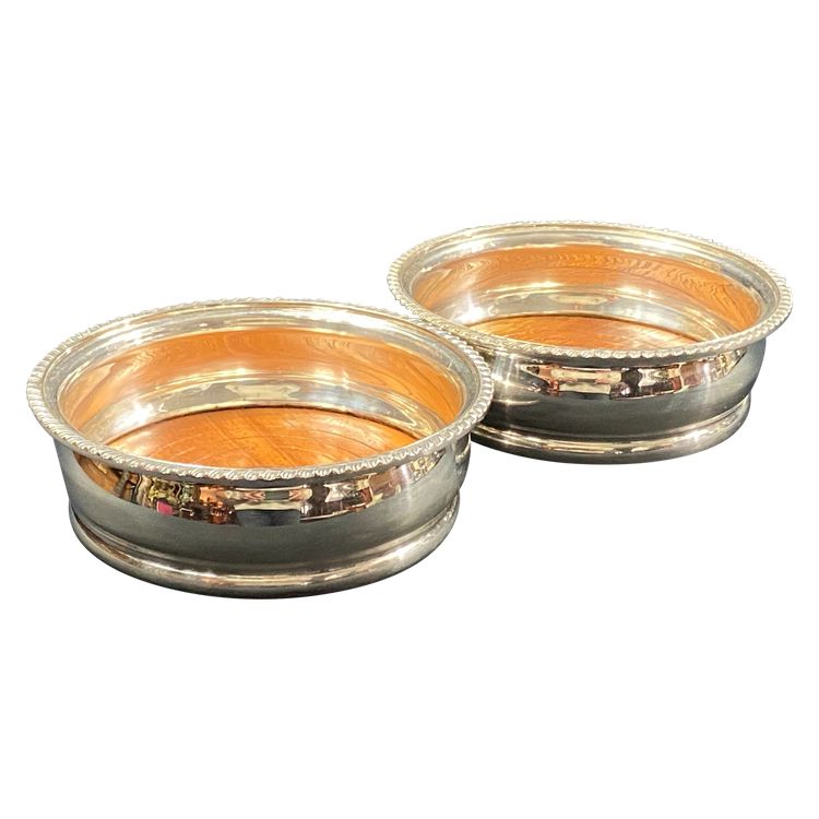 Pair of Louis XV style silver-plated metal coasters