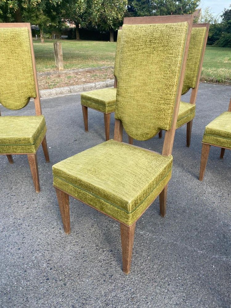 suite de 7 chaises art deco en chêne dans le style de Maurice Jallot, André Arbus, circa 1940