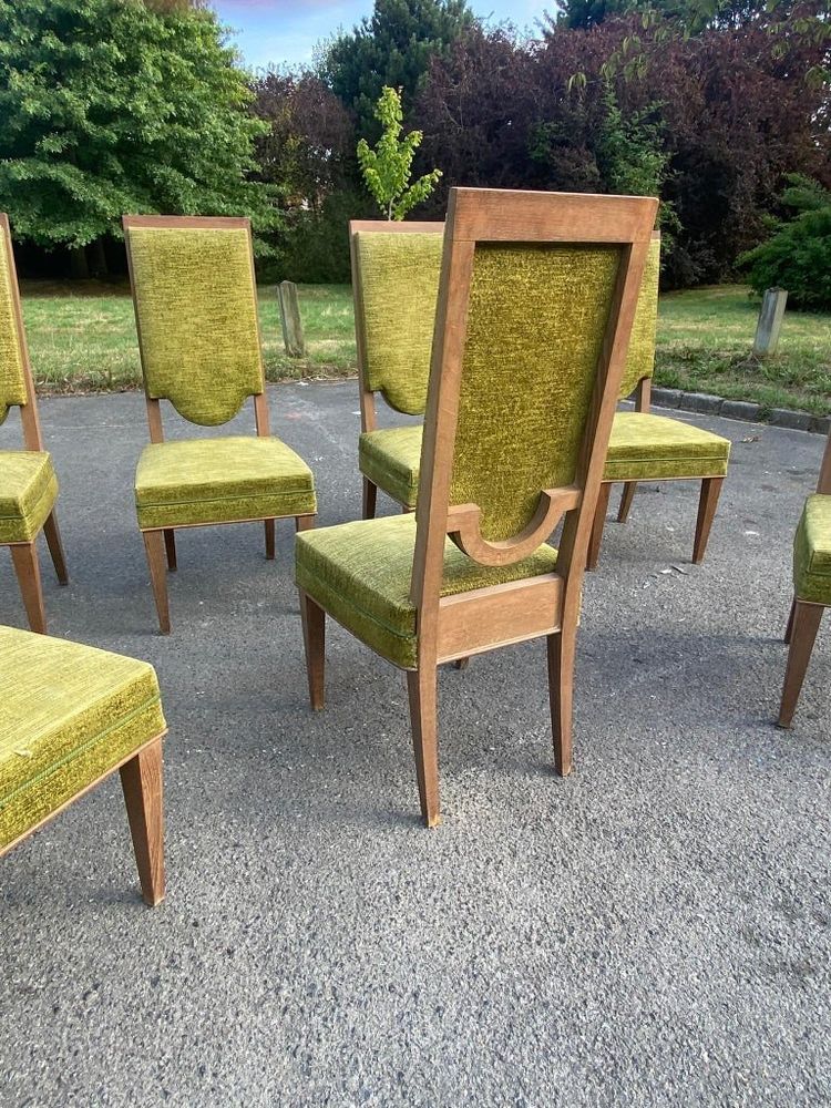suite de 7 chaises art deco en chêne dans le style de Maurice Jallot, André Arbus, circa 1940