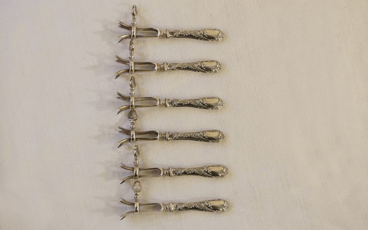  Set aus 6 Kotelettzangen Massivsilber