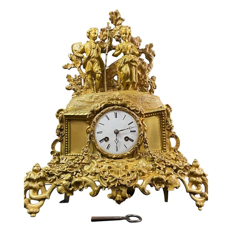 Pendule XIXe au jeune coupe romantique en bronze doré époque 1830