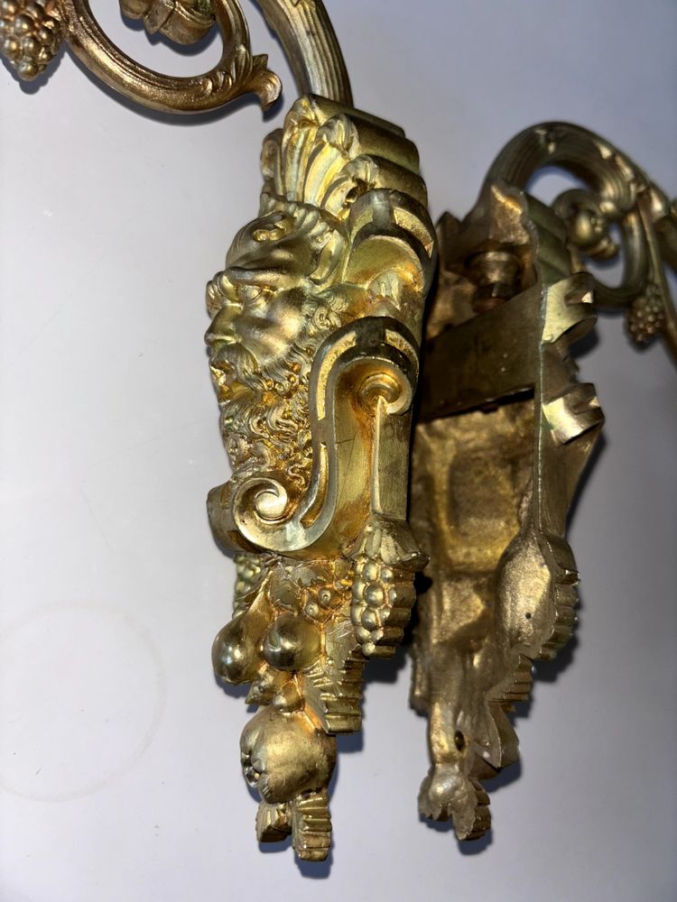 Pair of Louis XIV style sconces in chased ormolu Decorated with mascaron ( bacchus )