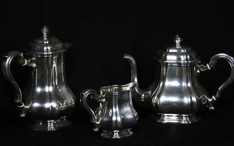 Served in solid silver tea, coffee and sugar pot