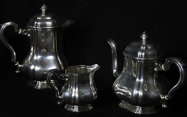 Served in solid silver tea, coffee and sugar pot